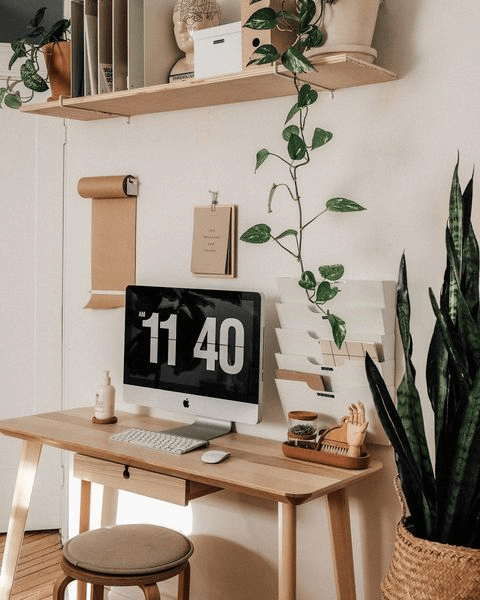 These two gaming room setups (both created by Brook And Peony) show how to use simple furniture pieces paired with a color scheme of light natural wood and white can create a base that goes with any accessories that you may want to add on, whether that's plants or nice leather mousepads.